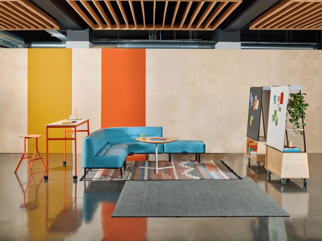 Blue corner office sofa in drop-in office space